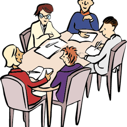 Bild einer Sitzung mit fünf Menschen an einem Tisch.